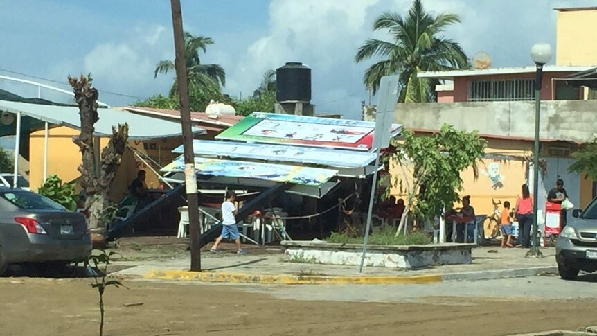 Sign flattened by Hurricane Patricia in Manzanillo