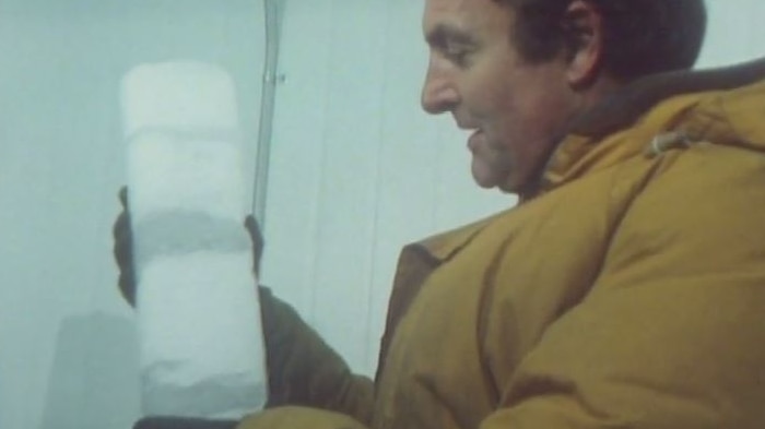 Towards 2000 reporter Iain Finlay handling an ice core in the freezer