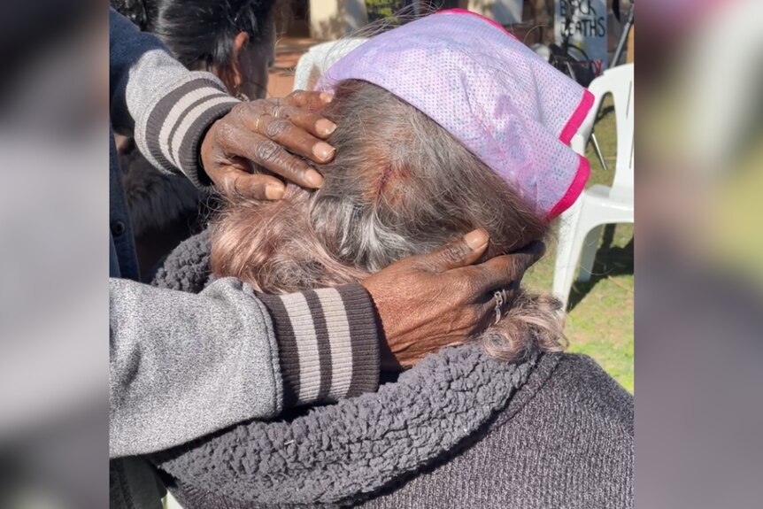 The back of a woman's head showing a bleeding injury