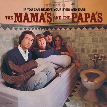 The members of the Mamas & The Papas all sit in an empty bath in a bathroom