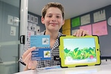 Hamish Finlayson with his two business cards and app.