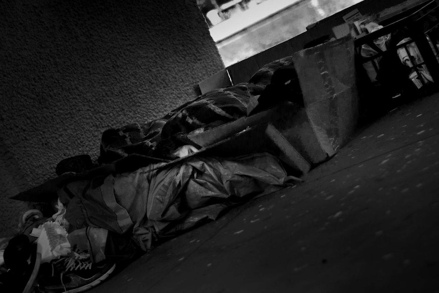 Homeless person sleeping in Melbourne.