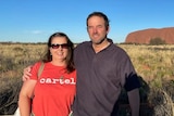A woman and a man near Ayers Rock in Northern territory.
