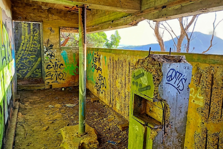 Graffitti inside a stone military facility.