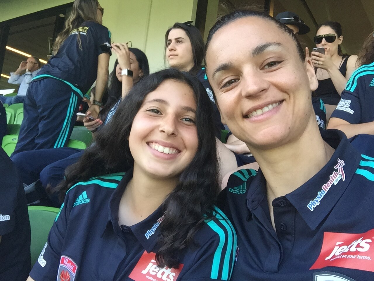 Two football players take a selfie during a football match