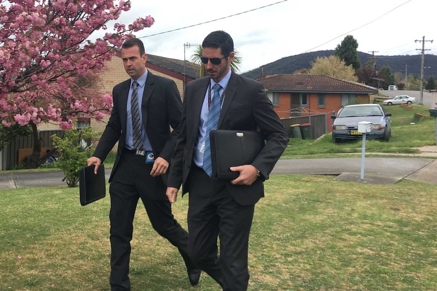 Two detectives from the Child Abuse Squad at a Lithgow home investigating how an 11-month-old girl received serious injuries