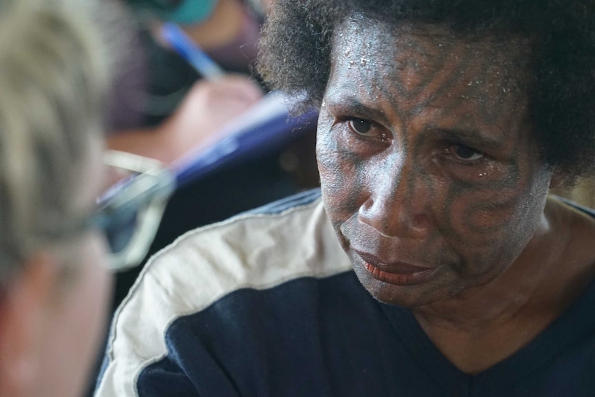 An Oro Province woman with facial tattoos at the health clinic.