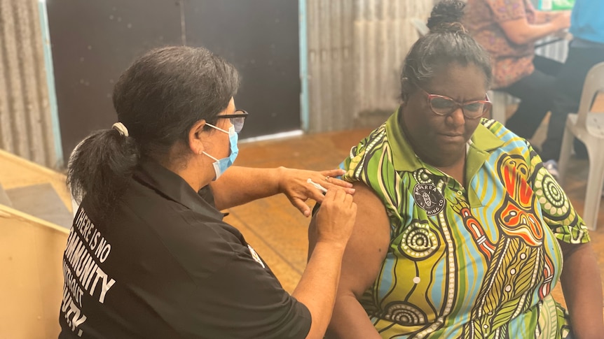 Vaccine nurse administering the Pzifer shot to Cherbourg local in Pfizer pop up clinic