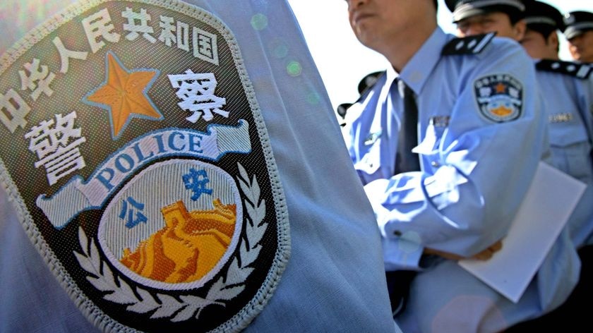 Chinese policemen line up during an opening ceremony