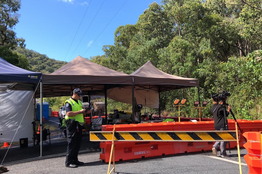 Police at the checkpoint at Yarrabah, south of Cairns.