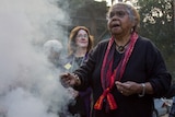 Aunty Ali Golding performing a smoking ceremony