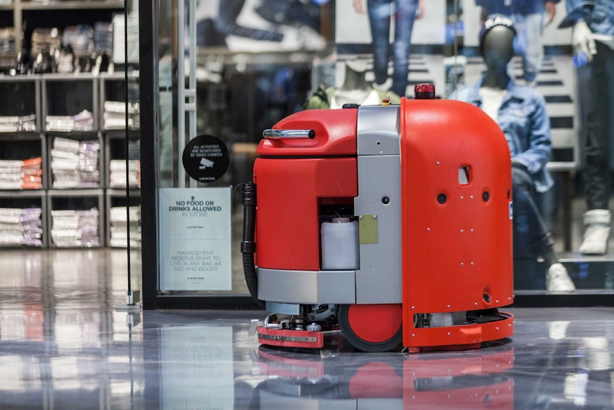 Bright red cleaning robot.