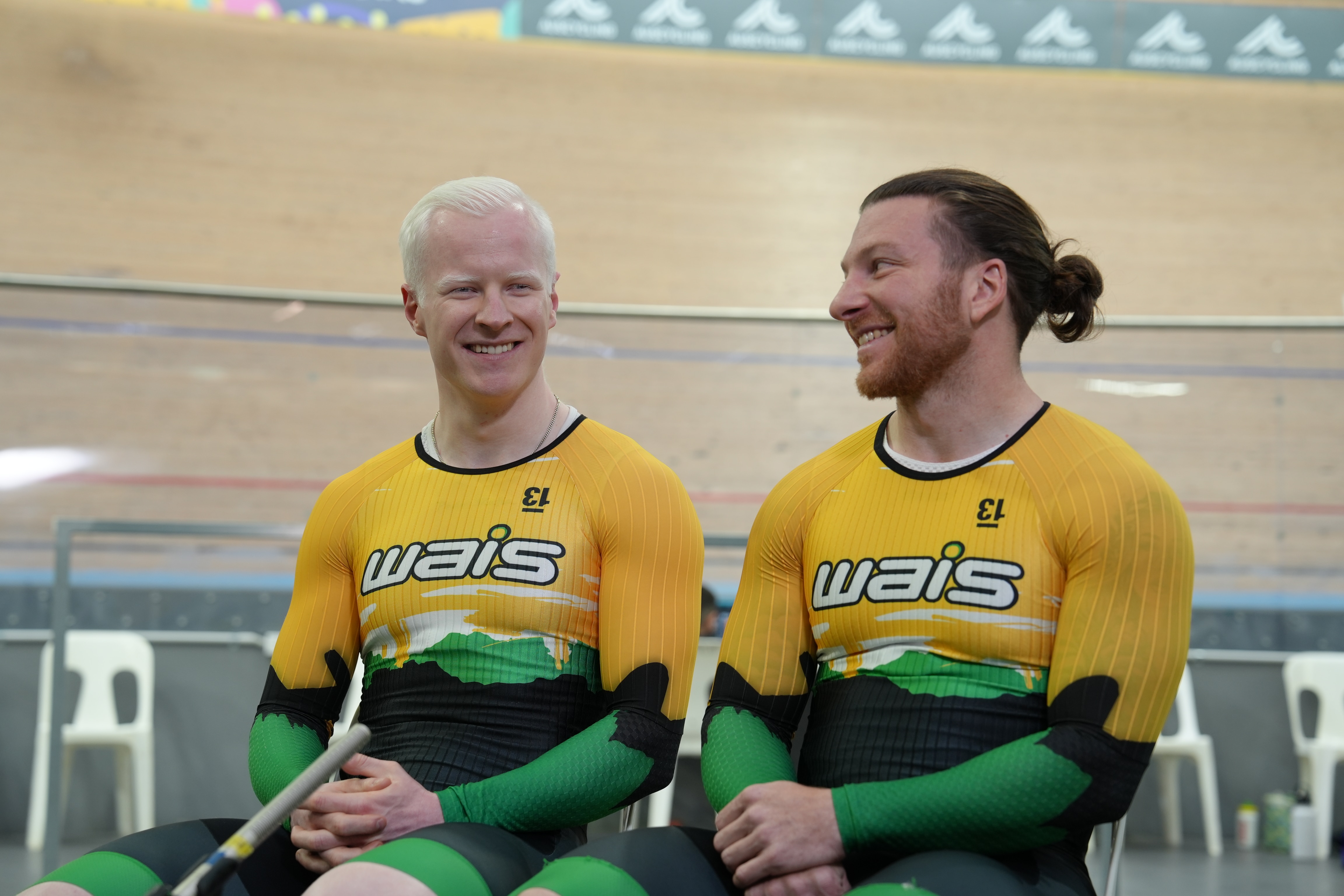 Cyclists Luke Zaccaria (front) and Kane Perris sit smiling.