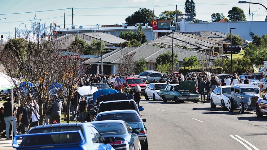 Gillieston Heights residents gather on street for a BBQ and car and bike show.