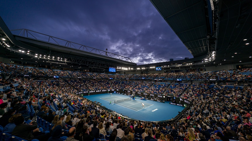 Wide angle shot of a packed Rod Laver Arena at night