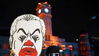 Malaysia's new prime minister Muhyuddin Yassin is depicted by a protester as a clown.