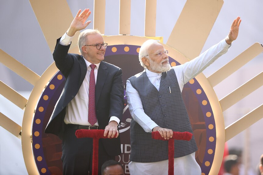 Australian Prime Minister Anthony Albanese and Indian Prime Minister Narendra Modi are seen on a lap of honour in Ahmedabad.