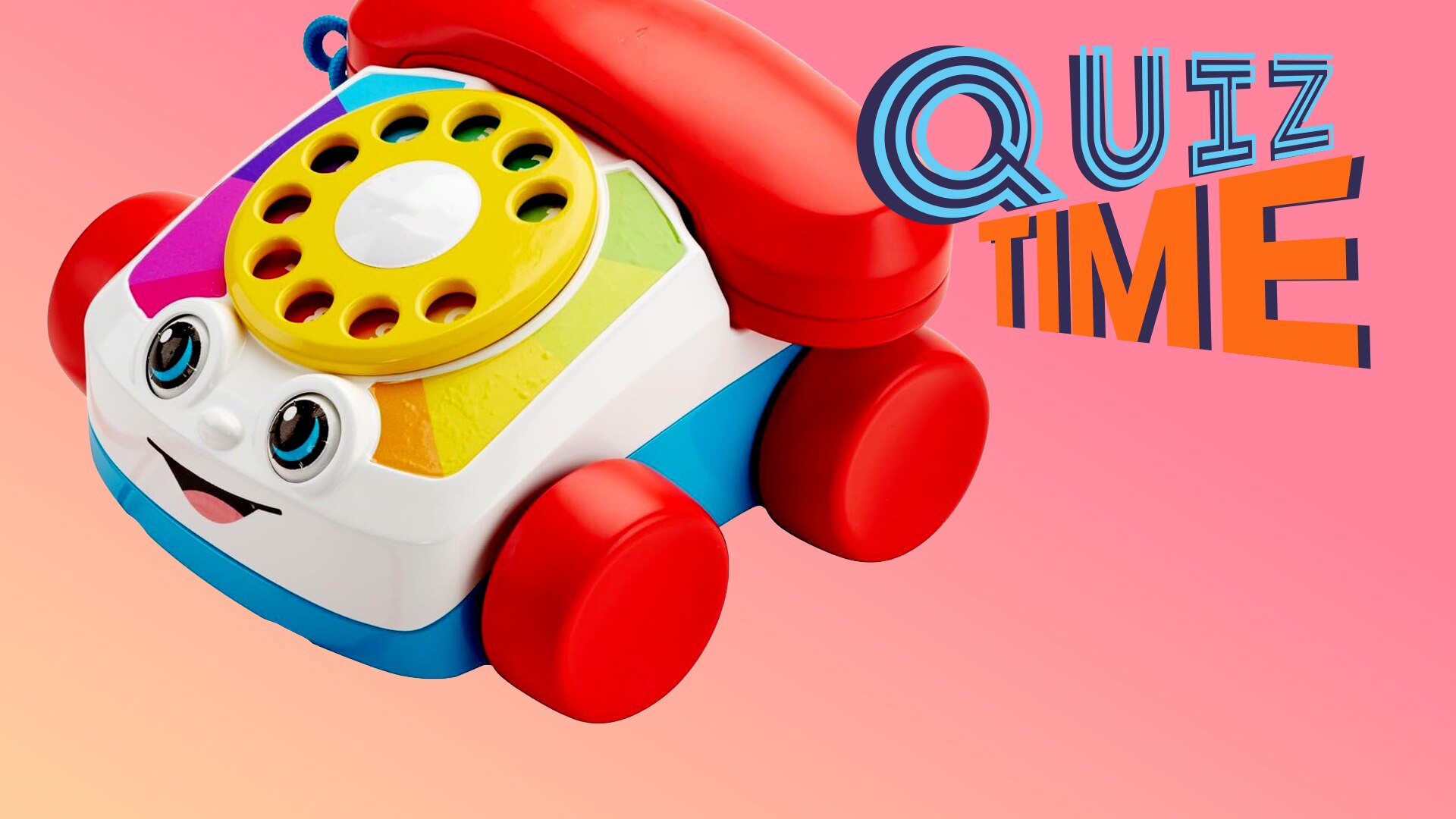 A retro telephone with a rotary dial kids toy with a smily face and on wheels. Quiz Time.