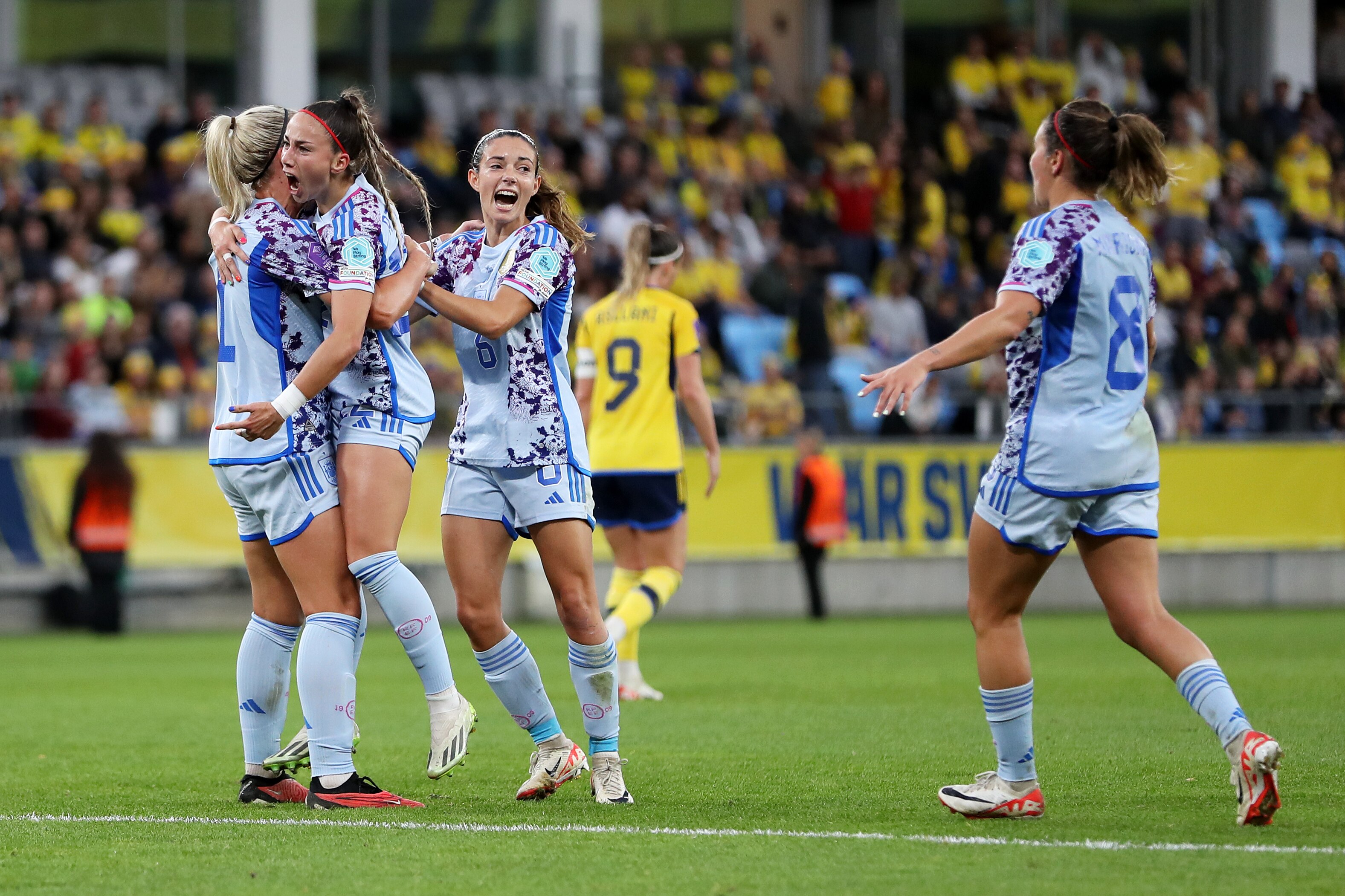 Four Spanish players celebrate a goal against Sweden during the WEFA Women's Nations League match.