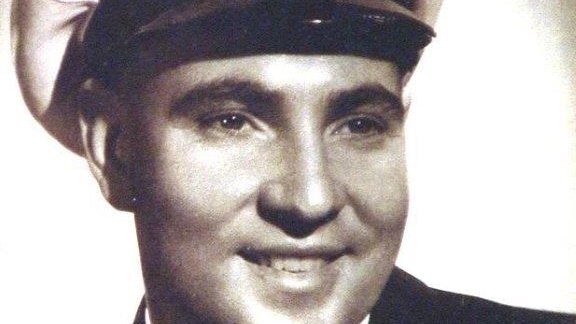 Kenneth Briggs smiles in his navy uniform.