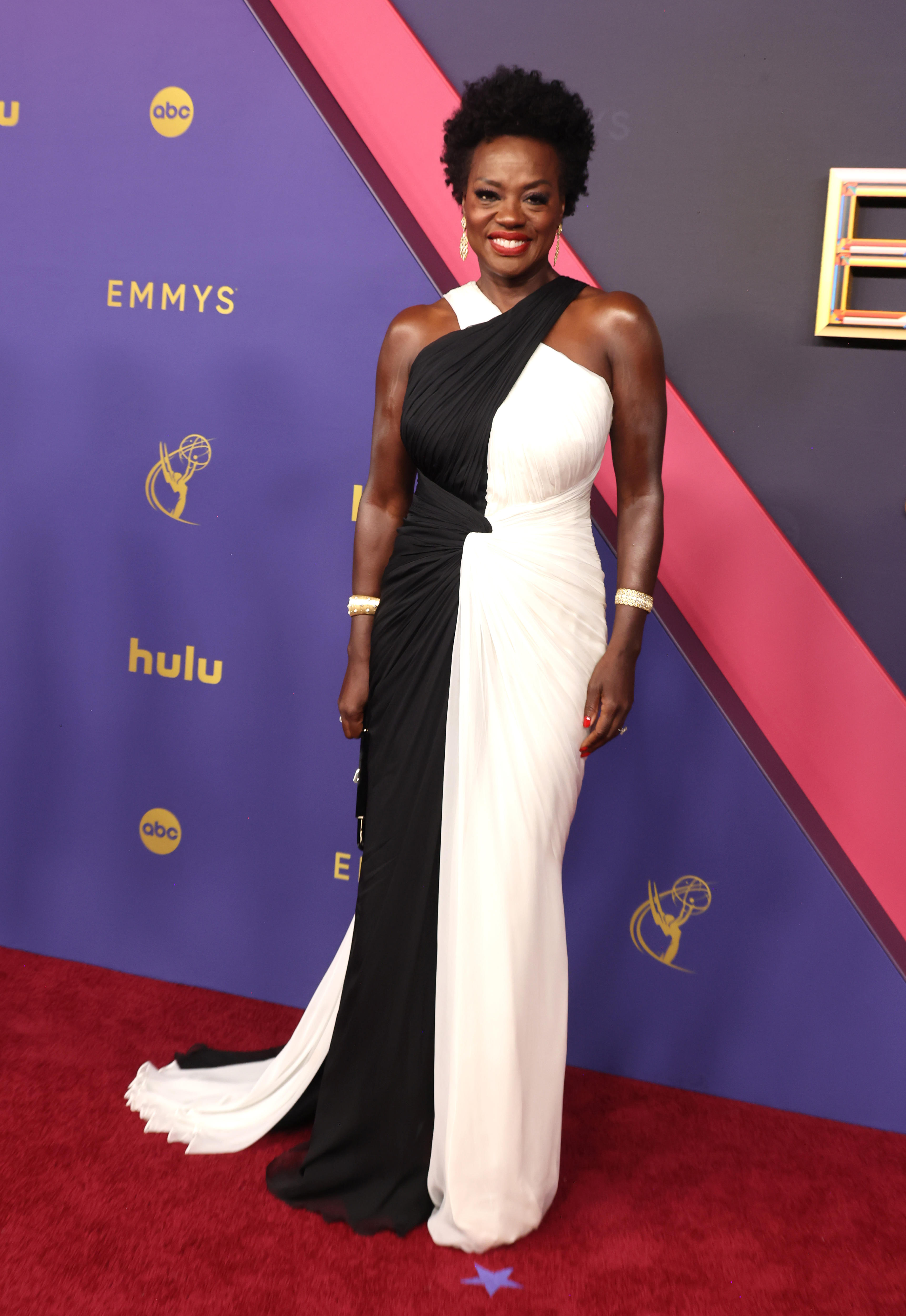 Viola Davis wearing a halter necked gown which is half black and half white