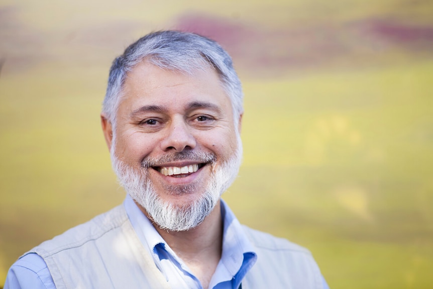 a man with beard looking at the camera