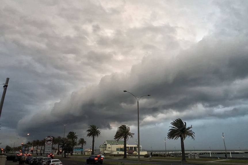 A band of grey clouds roils over Port Phillip in bay.