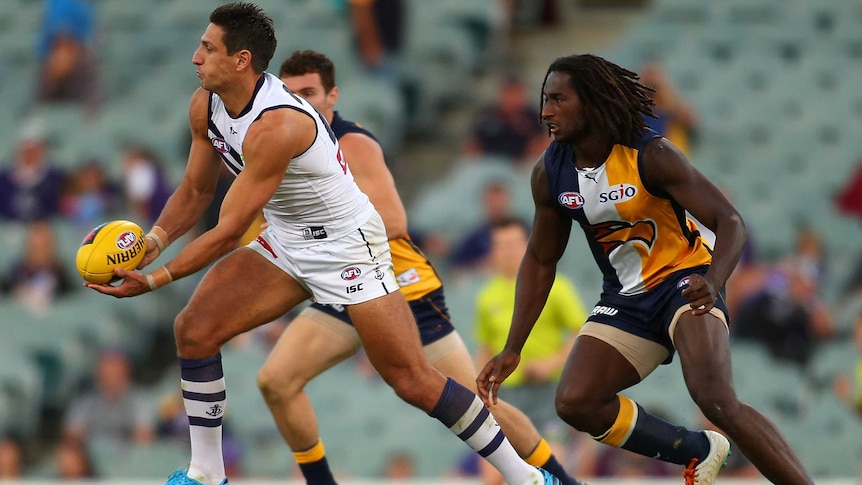 Fremantle's Matthew Pavlich looks to pass against the West Coast Eagles at Subiaco Oval.