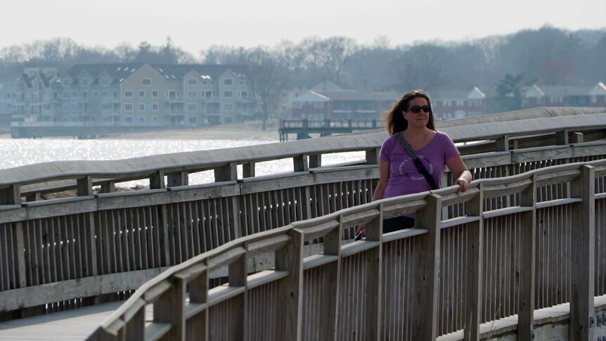 Amy Lappos standing on a pier