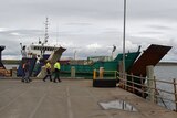 Freight ship Statesman docks at Lady Barron wharf, Flinders Island.