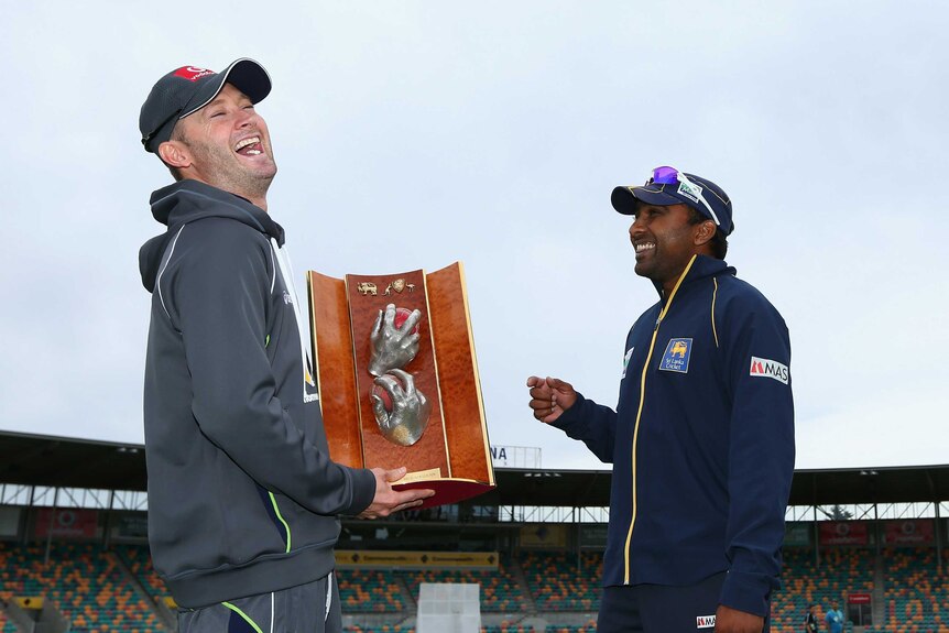 Friendly rivals ... Opposing captains Michael Clarke (L) and Mahela Jayawardene share a laugh on the eve of the First Test