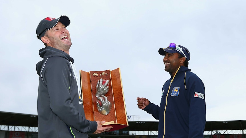 Friendly rivals ... Opposing captains Michael Clarke (L) and Mahela Jayawardene share a laugh on the eve of the First Test