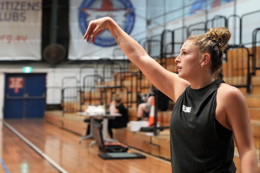 Tiana Mangakahia's arm is in the air after shooting the ball during training