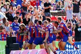 Nathan Ross (L) and the Knights celebrate try against Gold Coast at Hunter Stadium in round 2, 2017.