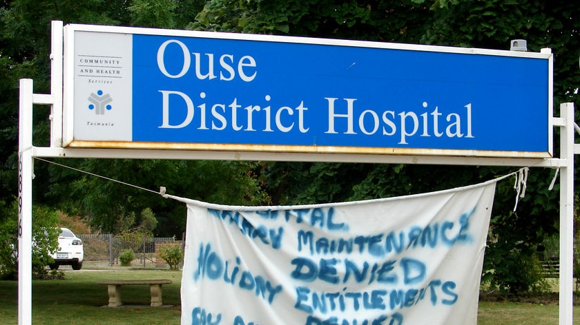 Sign with protest banner outside Ouse District Hospital, Tasmania