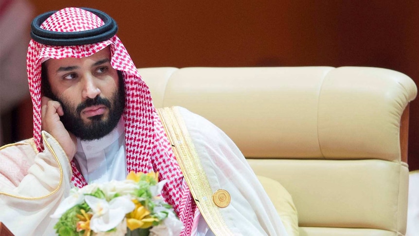 Crown Prince Mohammed bin Salman rests his head on his hand at the 29th Arab Summit