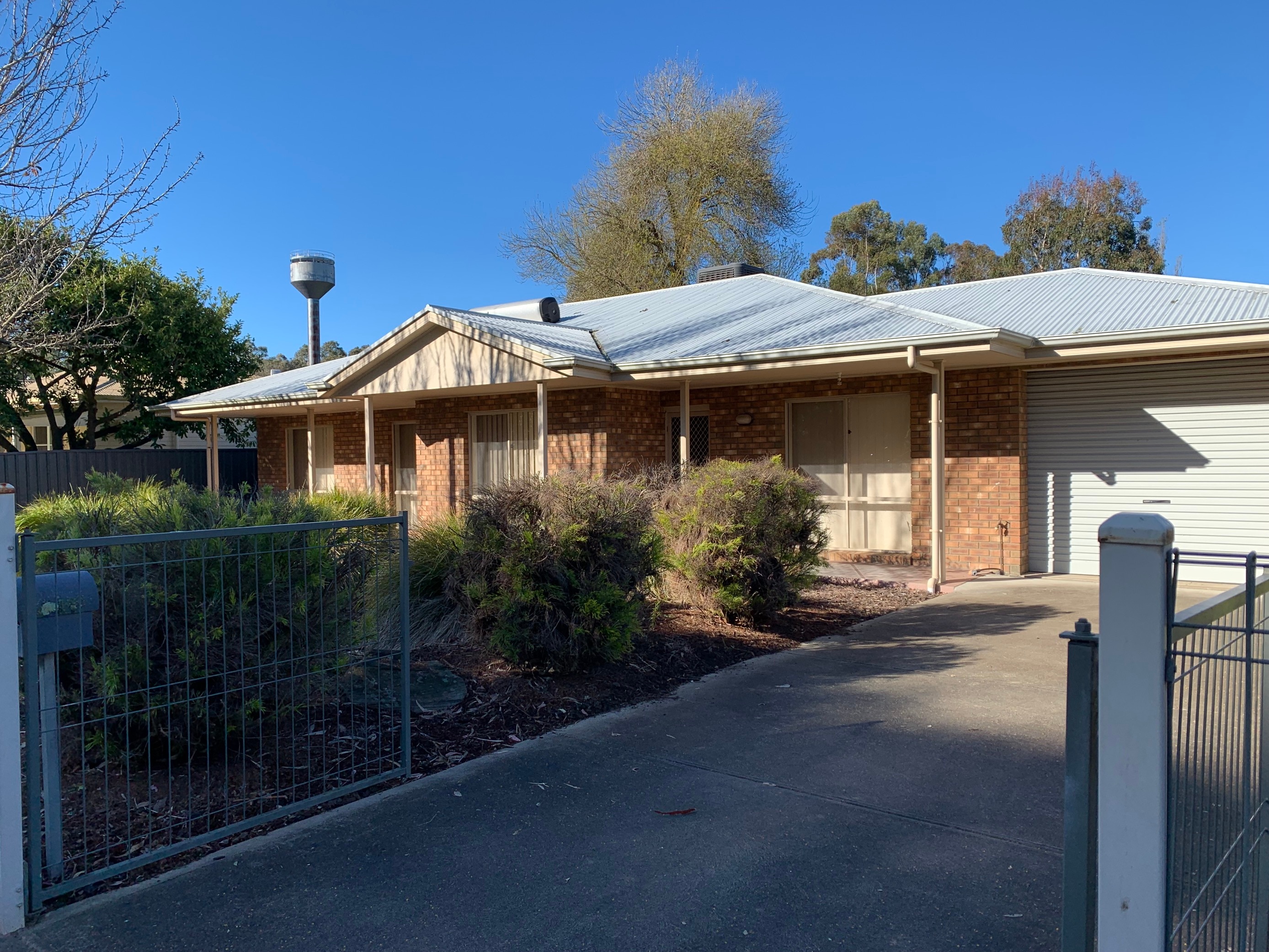 A small brown brick house