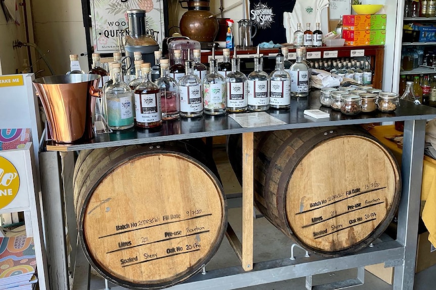 Two rum barrels and spirit bottles