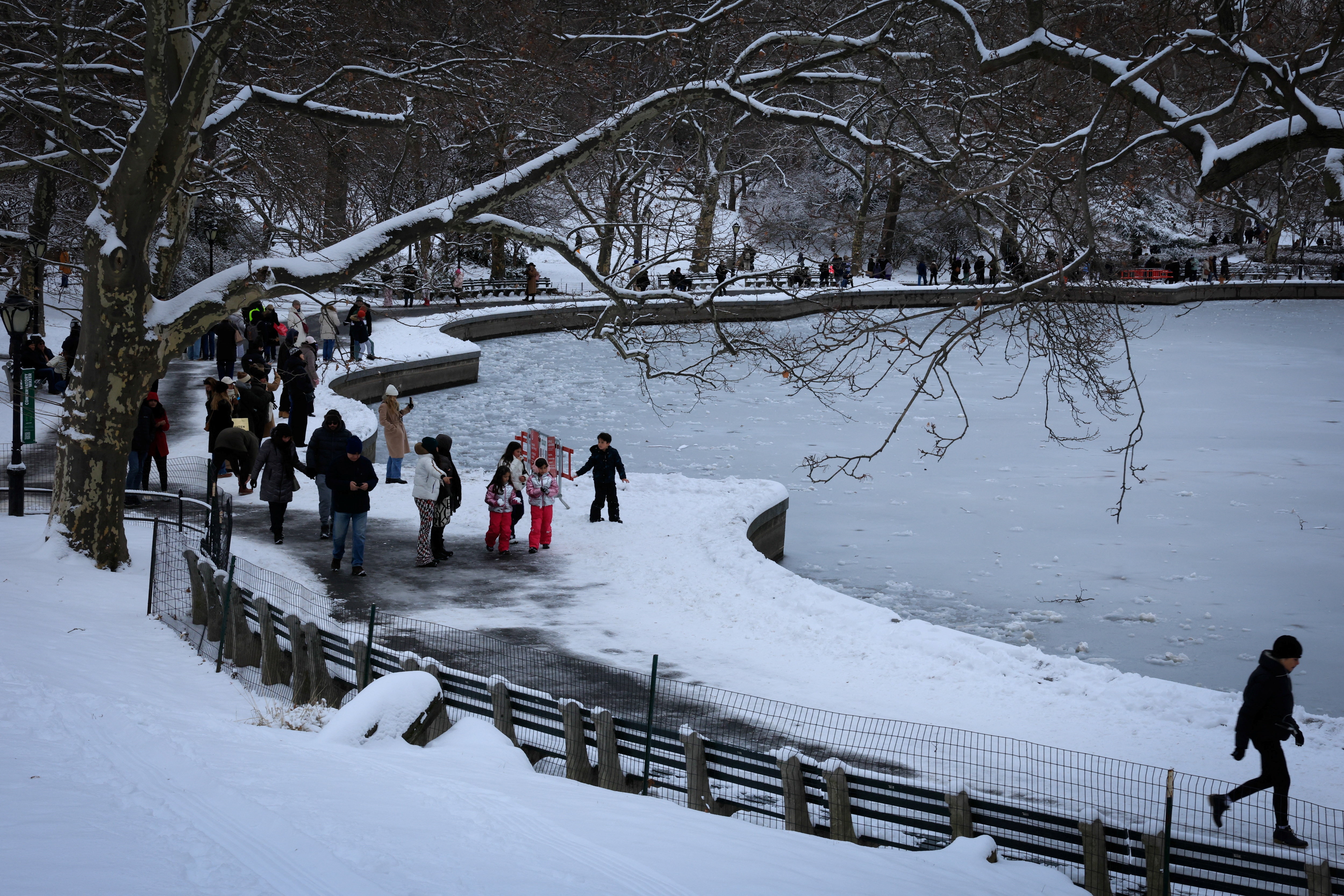 US holiday travel disrupted as snow blankets New York City
