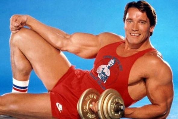 Schwarzenegger lifting weights.