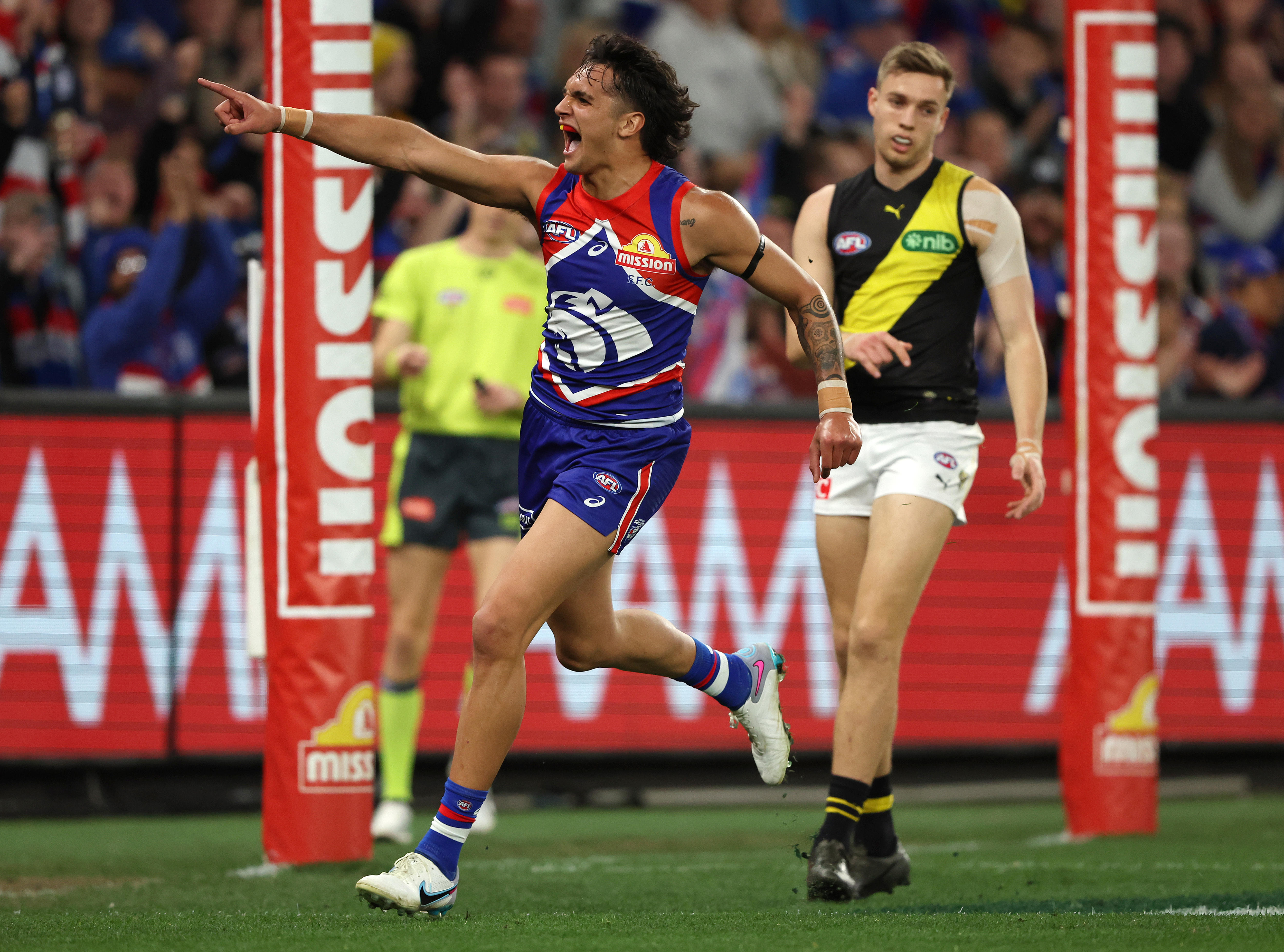 Jamarra Ugle-Hagan points to the crowd as he celebrates a goal