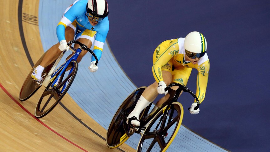 Anna Meares (yellow) defeats Lyubov Shulika during the track cycling women's sprint quarter-finals.