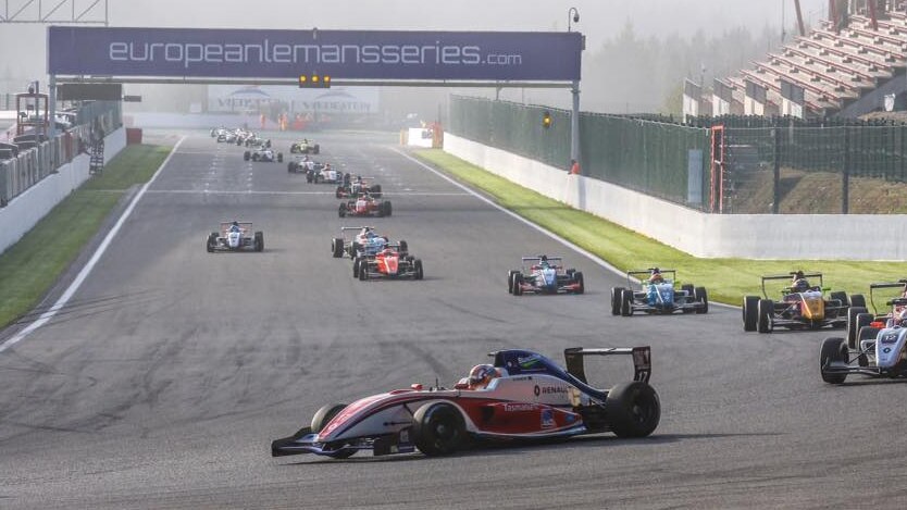 Racing cars on a track in Europe.