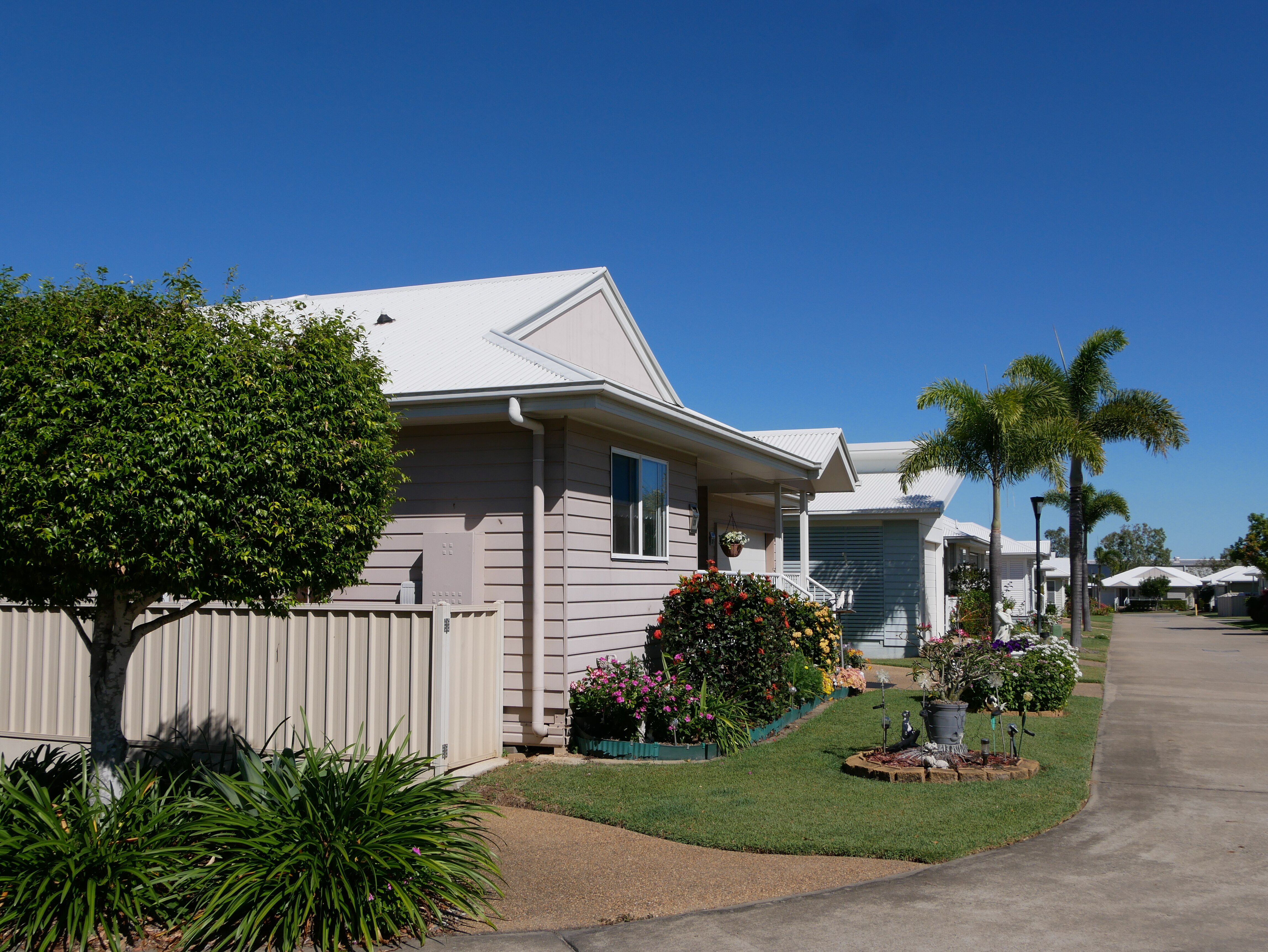 A row of homes and gardens at a retirement village. 