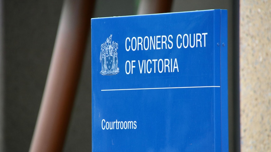 A blue sign reads 'CORONERS COURT OF VICTORIA', with a symbols of the justice system.