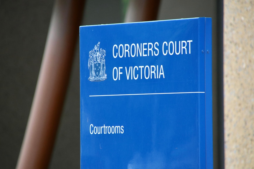 A blue sign reads 'CORONERS COURT OF VICTORIA', with a symbols of the justice system.