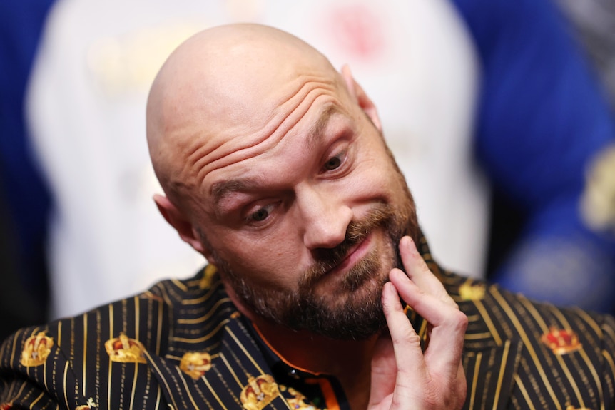 Tyson Fury scratches his chin