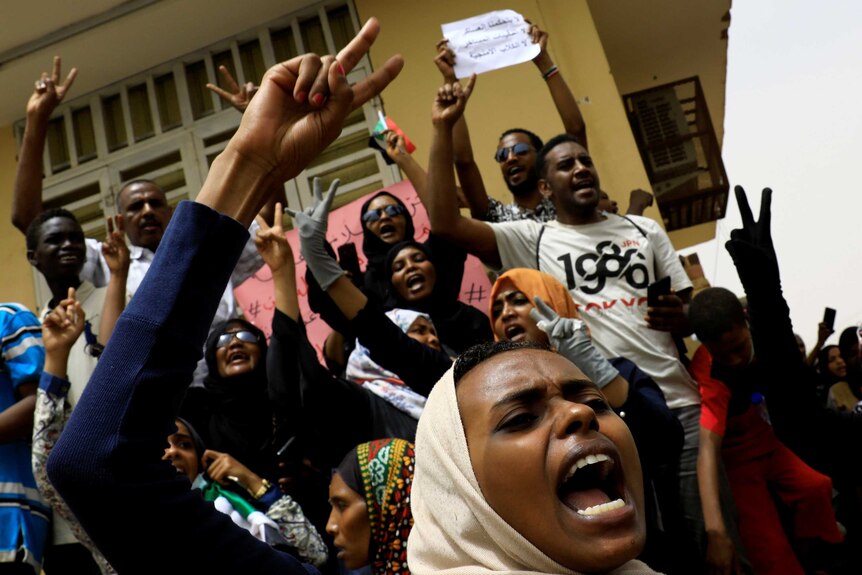 People shout slogans as they march on the streets of Khartoum, Sudan.