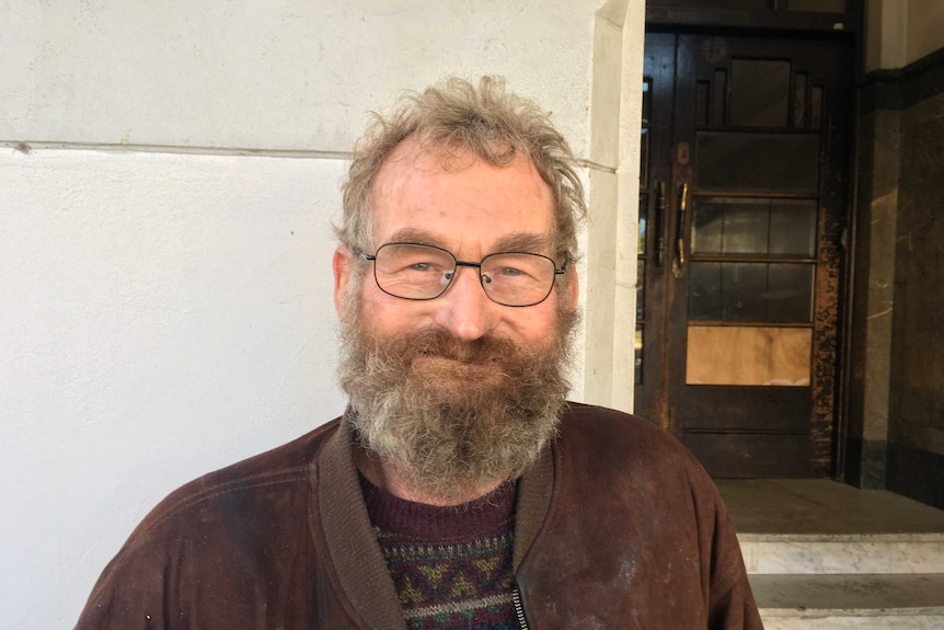 Duncan McIntyre stands in front of the Gatwick rooming house on Fitzroy Street in St Kilda.