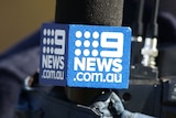 Close-up shot of a Nine logo guard on a TV microphone
